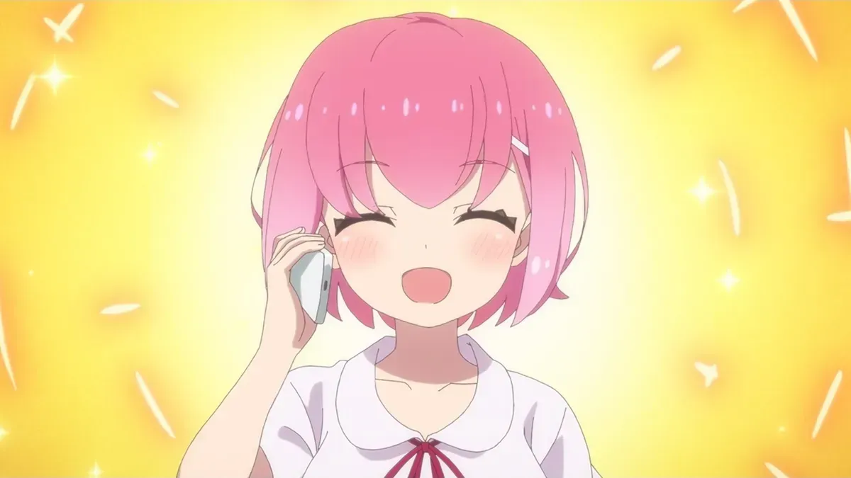 A girl with short pink hair and a white blouse with a red ribbon beams with her eyes shut while holding a phone to her ear against a sparkling yellow background, in a still from FX Fighter Kurumi-chan episode 3