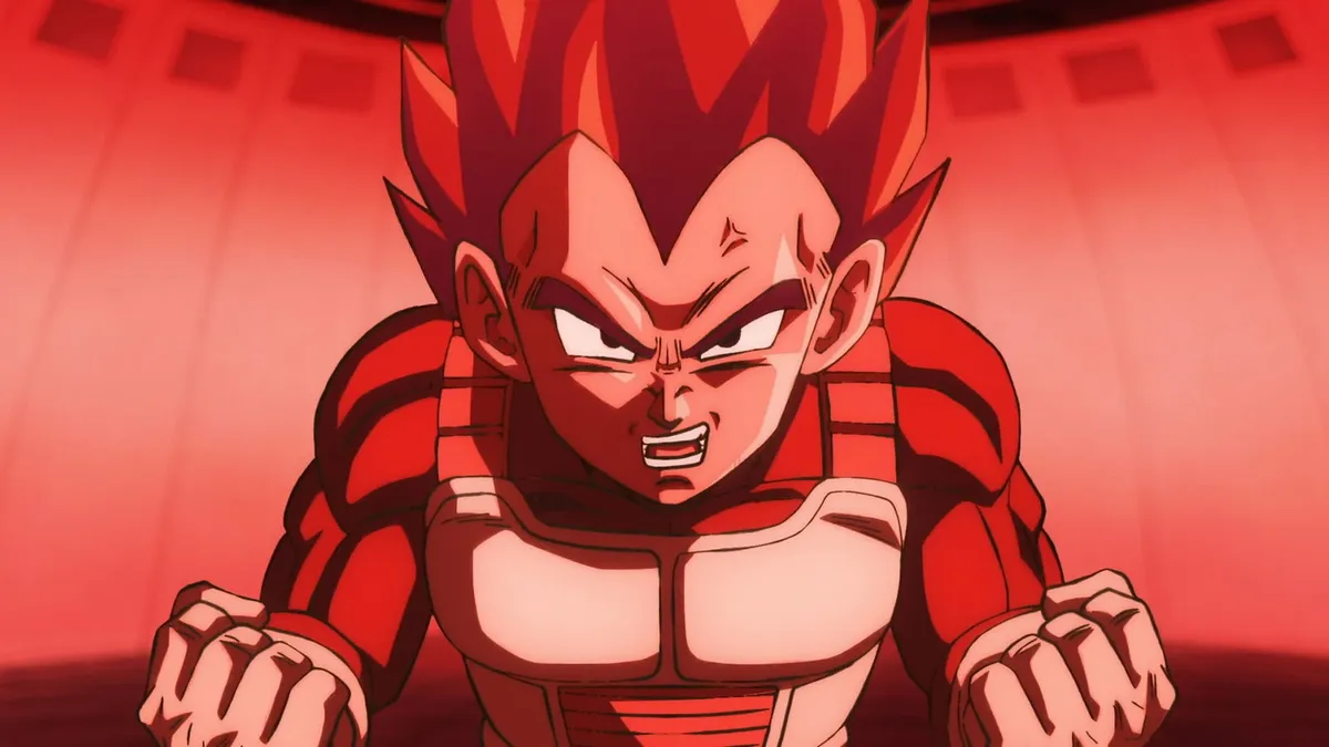 Vegeta strains with clenched fists under red light in the gravity room, in a still from Dragon Ball Super: Beerus episode 1
