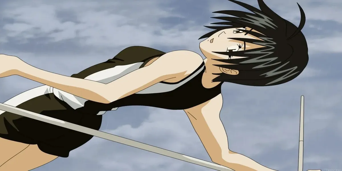 A girl with short dark hair arches backwards over a high-jump bar against a cloudy sky, in a still from Suzuka